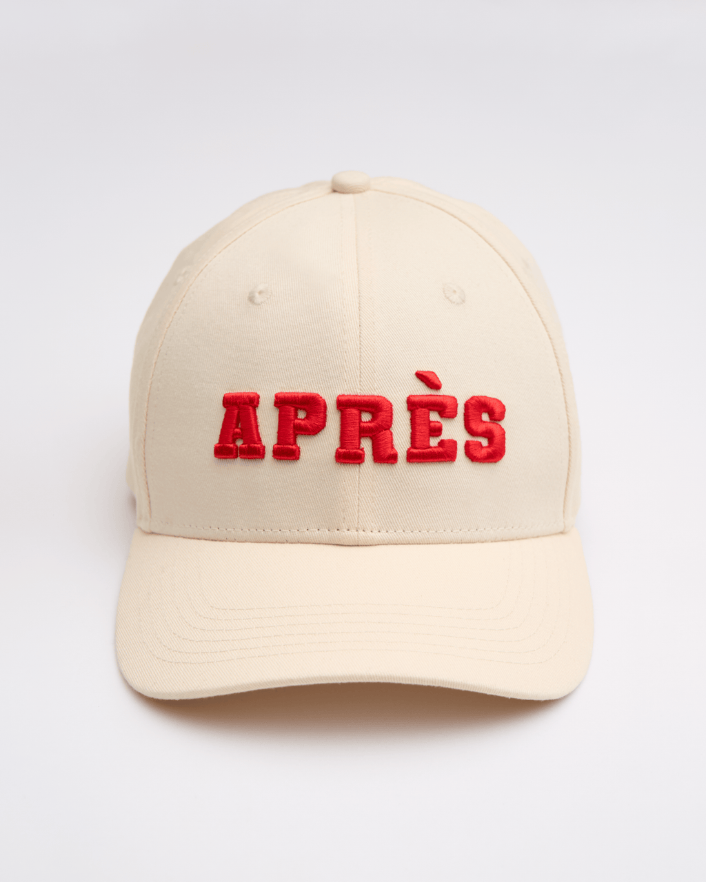 Beige cap with red 'APRES' text